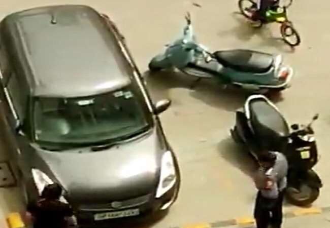 Woman hurled poles at car in parking dispute, video went viral